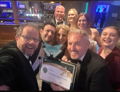 Members of The Flying High Trust central team with the award for Transformation and Impact. Photograph: Back row left to right are Grant Worthington, Zoe Maxey, Aimee Barton, Jay Attewell. Front row left to right: Pete Wilkes, Paul Goodman, Claire Stirland and Chris Wheatley OBE.